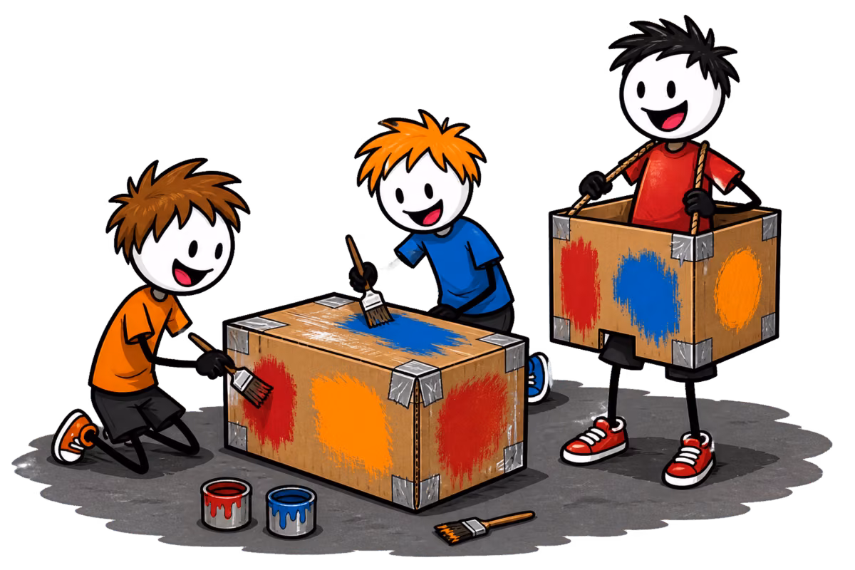 Mario Kart géant : l'atelier de fabrication des karts en carton, des enfants peignent deux caisses posées au sol pendant qu'un troisième a déjà enfilé la sienne, tenue par des cordes en bretelles et numérotée au pinceau